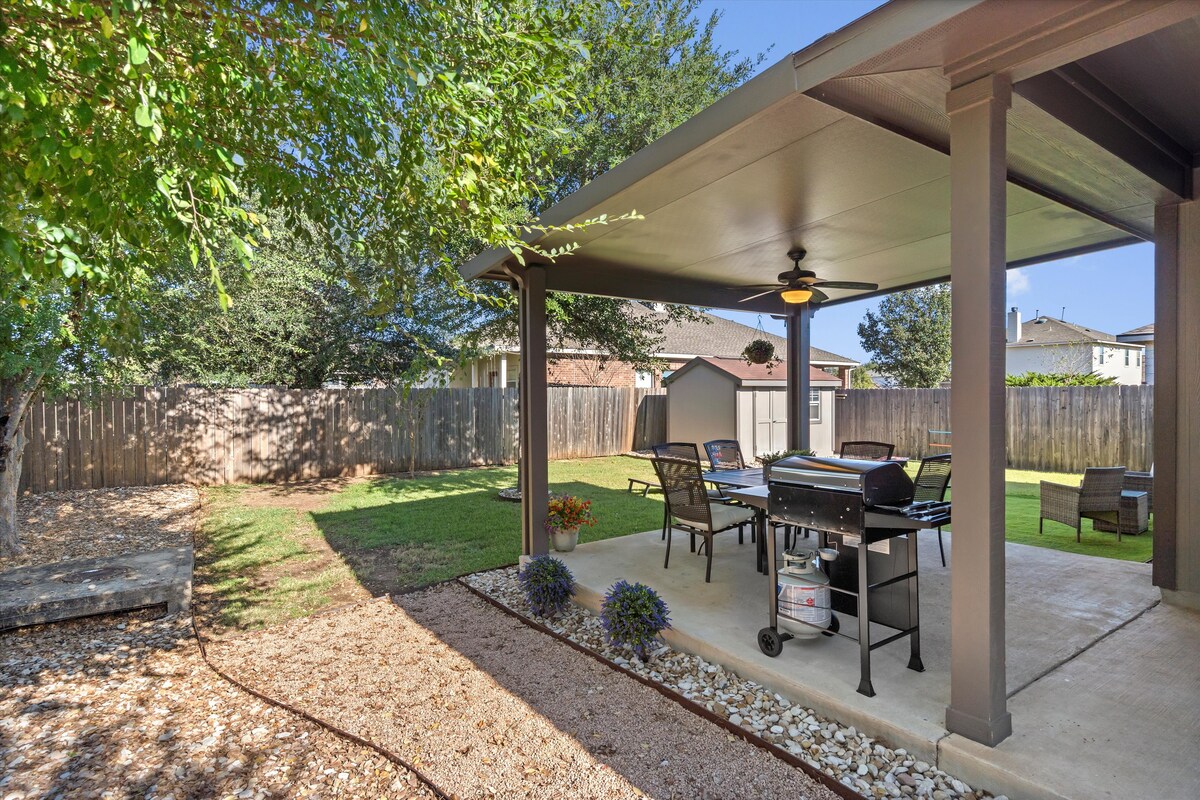 Backyard, Games & Grill covered patio with grill and dining table