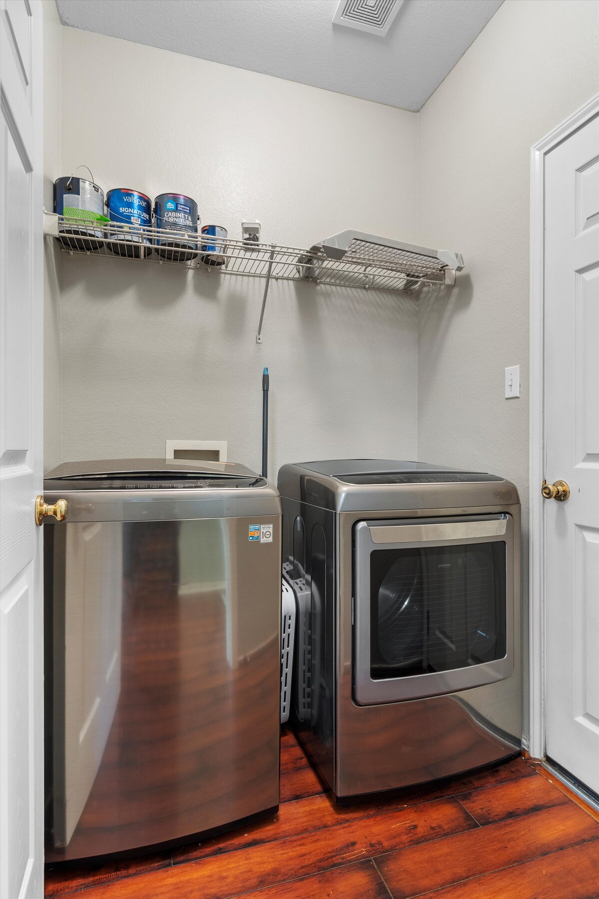 Backyard, Games & Grill laundry room with washer and dryer