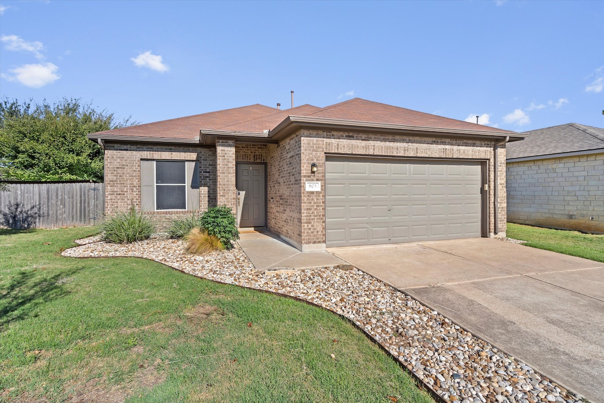 Backyard, Games & Grill brick ranch exterior and driveway